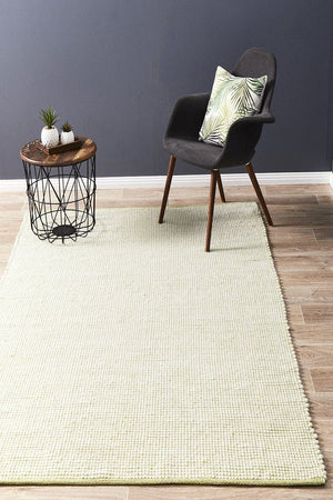 Evoke Pistachio felted wool flatweave rug — lifestyle shot in contemporary living room