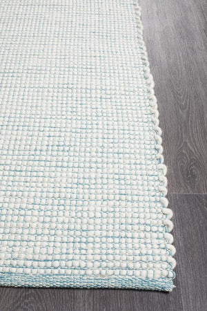 Evoke Turquoise wool rug styled in a coastal kids room
