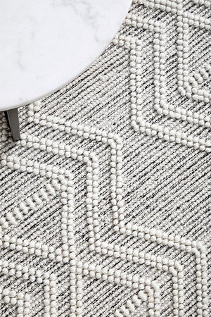 Clara hand loomed wool rug — top-down flat lay view