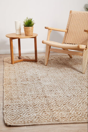 Byron 444 Natural jute rug — lifestyle shot in coastal living room