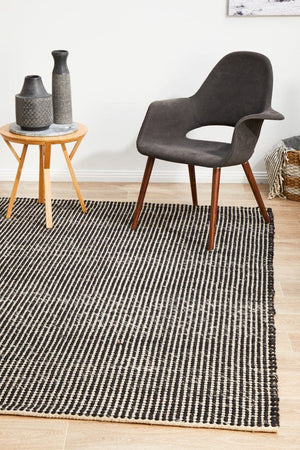 Navia Black flatweave rug — close-up of wool weave and pattern detail