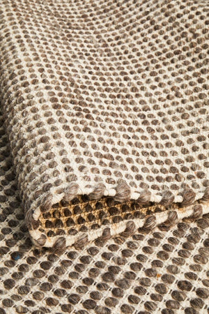 Navia brown flatweave wool rug — coastal interior styling