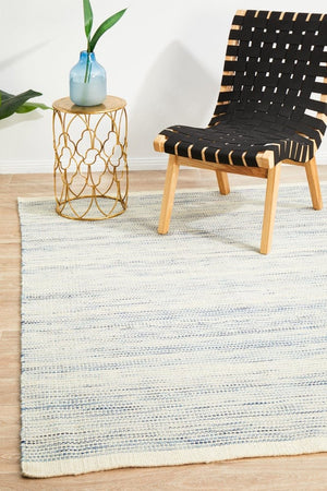 Navia Blue flatweave wool rug — lifestyle shot in contemporary living room