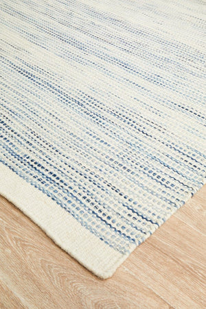 Navia Blue wool rug — side angle showing double-sided flatweave construction