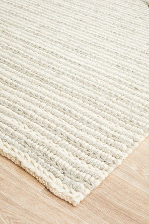 Navia 320 Grey wool rug — side angle showing 25mm felted pile depth