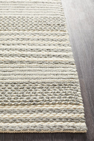 Navia 340 Silver rug styled in a contemporary minimalist bedroom