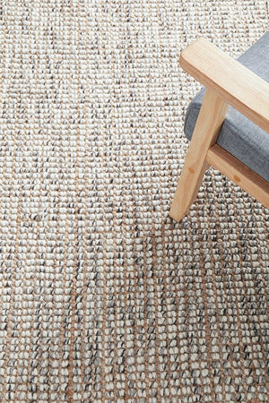 Scandi grey wool and jute rug — lifestyle shot in Scandinavian-style living room