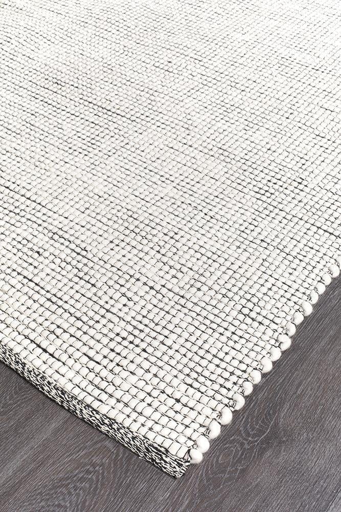 Evoke Black flatweave rug — close-up of felted wool weave detail