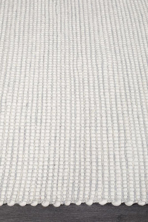 Evoke Grey rug — side angle showing double-sided flatweave construction