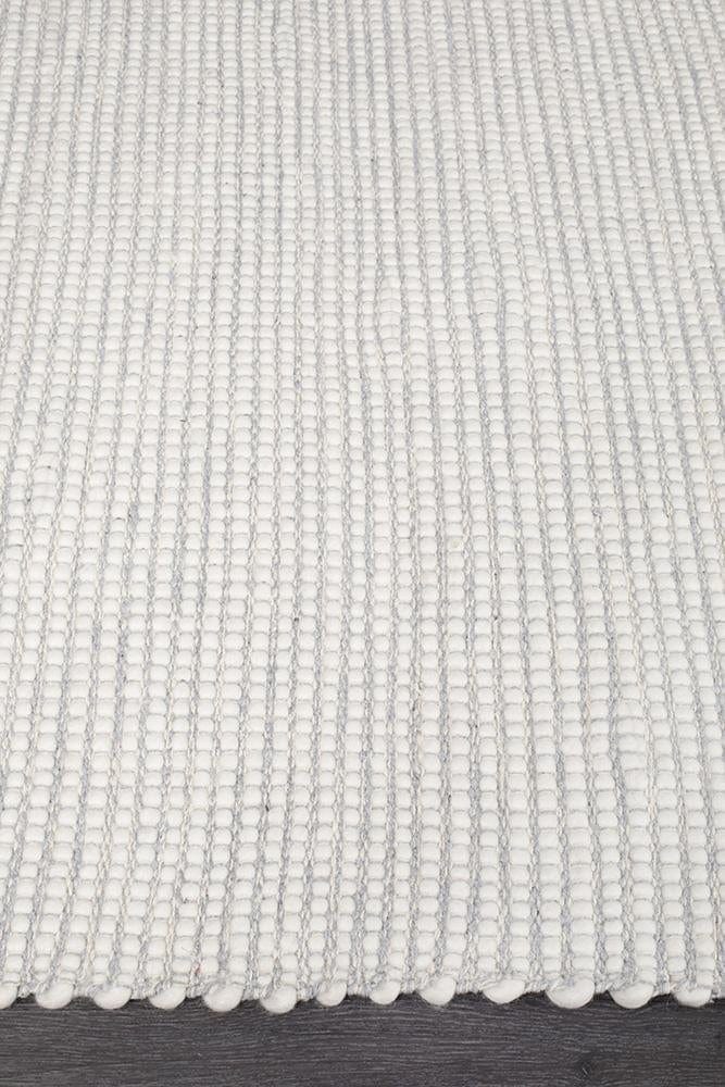 Evoke Grey rug — side angle showing double-sided flatweave construction