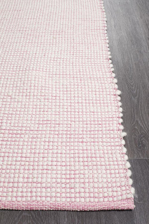 Evoke Pink wool rug styled in a kids bedroom