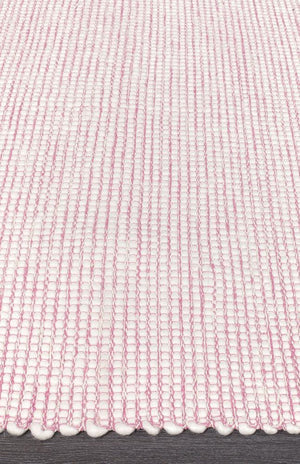 Evoke Pink rug — side angle showing double-sided flatweave construction