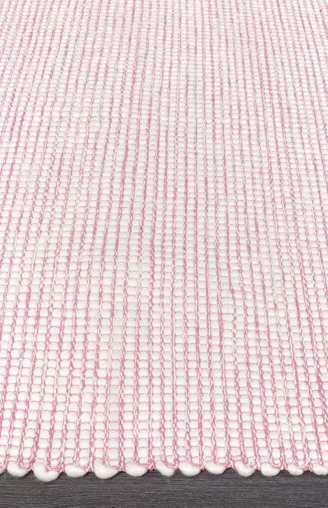 Evoke Pink rug — side angle showing double-sided flatweave construction