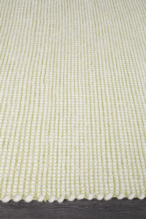 Evoke Pistachio rug — side angle showing double-sided flatweave construction