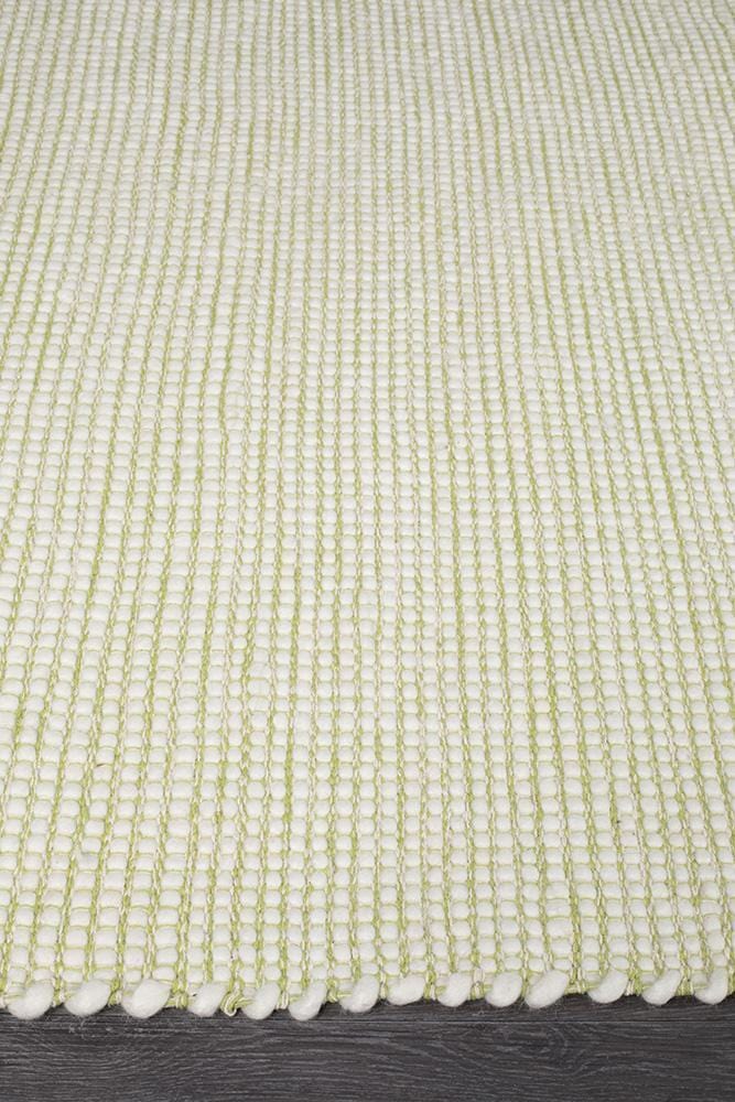 Evoke Pistachio rug — side angle showing double-sided flatweave construction