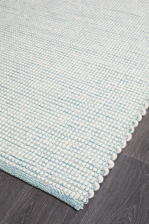 Evoke Turquoise flatweave rug — close-up of felted wool weave detail