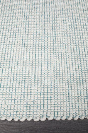 Evoke Turquoise rug — side angle showing double-sided flatweave construction