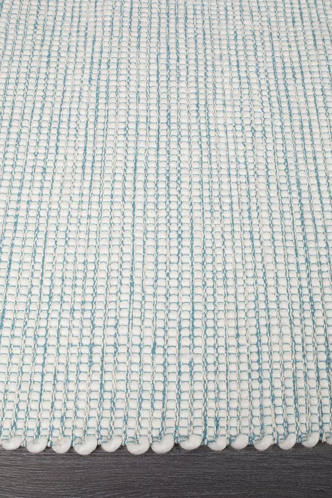 Evoke Turquoise rug — side angle showing double-sided flatweave construction