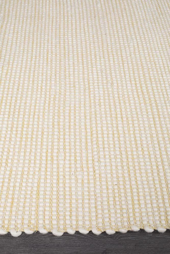 Evoke Yellow rug — side angle showing double-sided flatweave construction