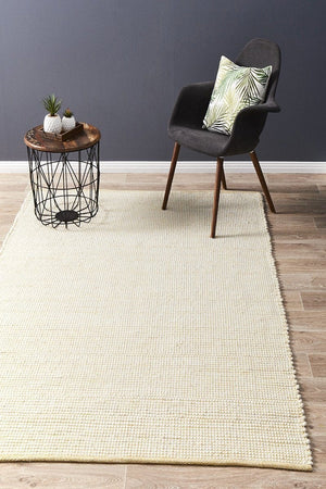Evoke Yellow felted wool flatweave rug — lifestyle shot in contemporary living room