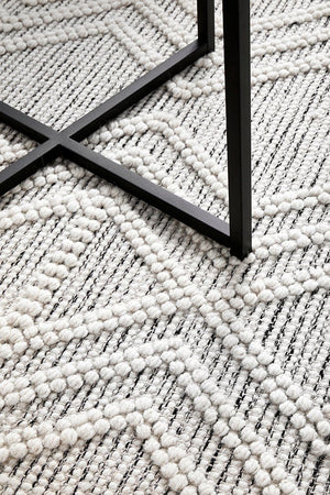 Clara wool rug styled in a living room setting