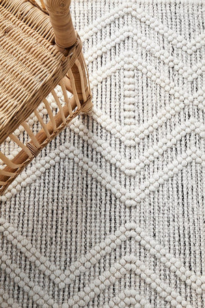 Clara flatwoven rug — neutral tones in a bedroom setting