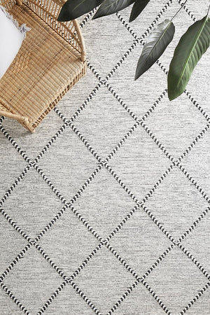 Jasmin flatwoven wool rug in black and ivory — lifestyle room shot