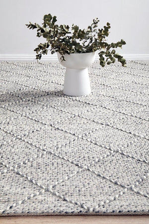 Noah hand loomed rug — side angle showing pile texture and geometric pattern