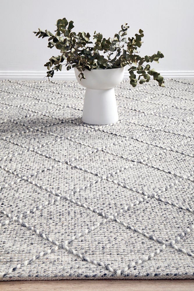 Noah hand loomed rug — side angle showing pile texture and geometric pattern