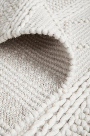 Zoe hand loomed rug — side angle showing pile texture and tribal pattern