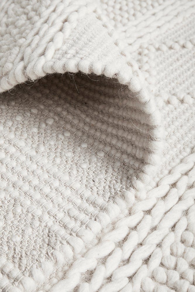 Zoe hand loomed rug — side angle showing pile texture and tribal pattern