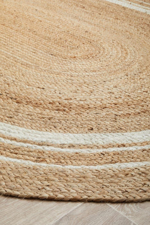 Byron 111 Natural Oval jute rug — side angle showing braided construction