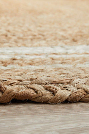 Byron 111 Natural Oval jute rug — detail shot of hand-braided stripe and chevron pattern