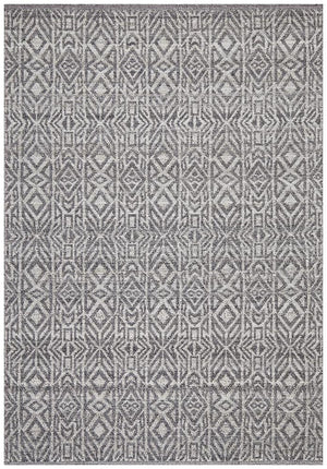 Sammy rug — top-down flat lay showing graphite and cobalt geometric pattern