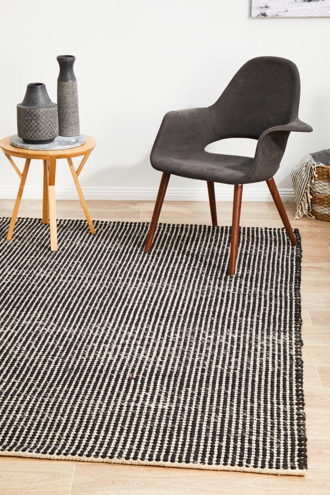 Navia Black flatweave rug — close-up of wool weave and pattern detail