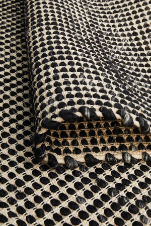 Navia Black flatweave wool rug — product shot showing full pattern