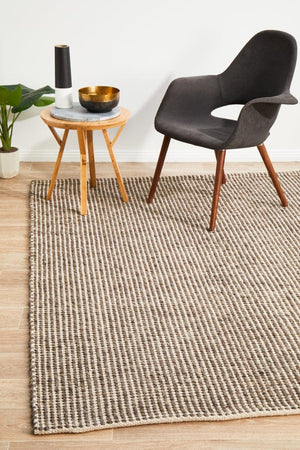 Navia brown flatweave wool rug — lifestyle shot in coastal living room