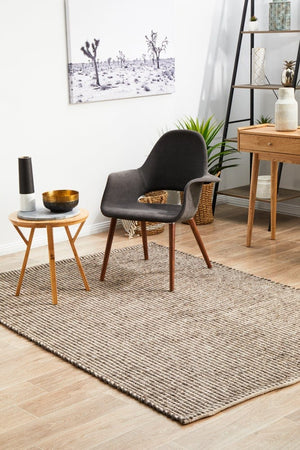 Navia brown rug — top-down flat lay showing warm earthy flatweave texture