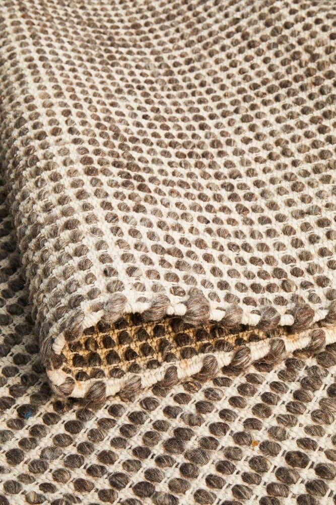 Navia brown flatweave wool rug — coastal interior styling