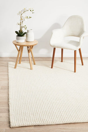 Navia White flatweave wool rug — lifestyle shot in bright Scandi living room