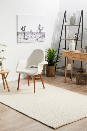 Navia White rug — top-down flat lay showing clean white flatweave texture
