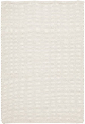 Navia White rug styled in a minimalist Scandi bedroom