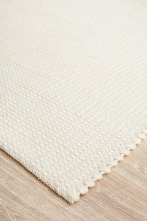 Navia White wool rug — side angle showing double-sided flatweave construction