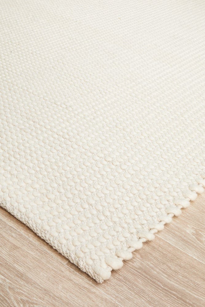 Navia White wool rug — side angle showing double-sided flatweave construction