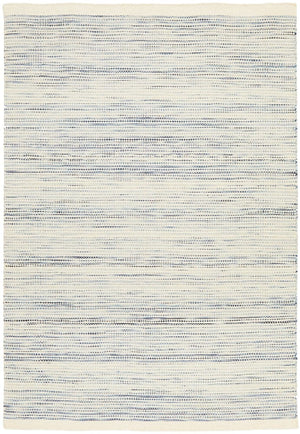 Navia Blue rug styled in a contemporary living room with natural timber