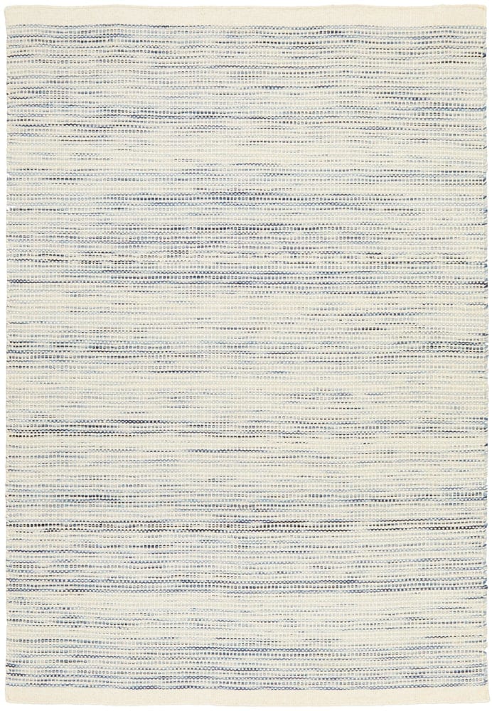 Navia Blue rug styled in a contemporary living room with natural timber