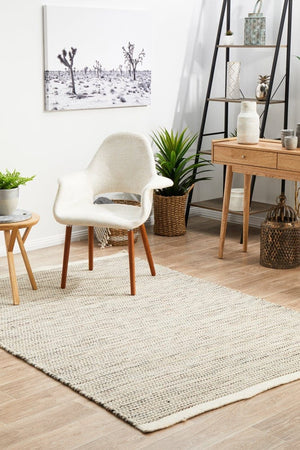 Navia Natural rug — top-down flat lay showing earthy natural flatweave texture