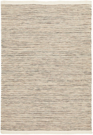 Navia Natural rug styled in a minimalist living room with timber floors