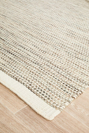 Navia Natural wool rug — side angle showing double-sided flatweave construction