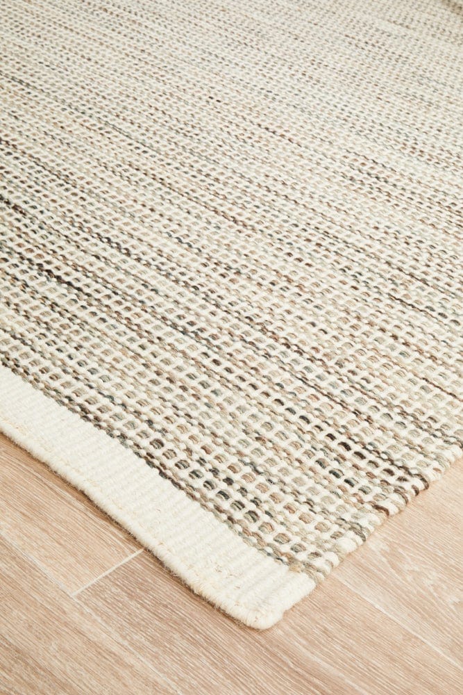 Navia Natural wool rug — side angle showing double-sided flatweave construction